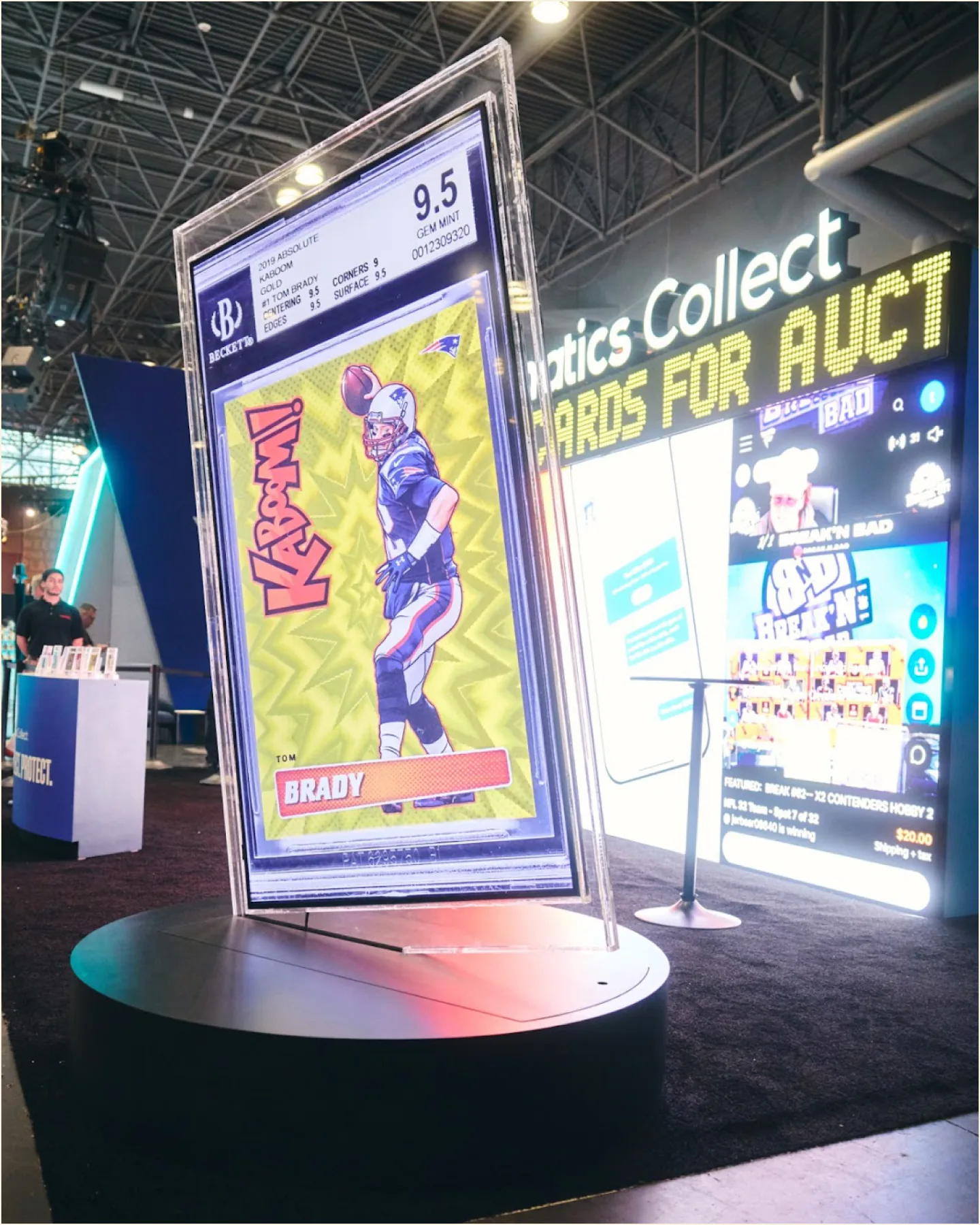 Oversized graded trading card on display at a fan festival
