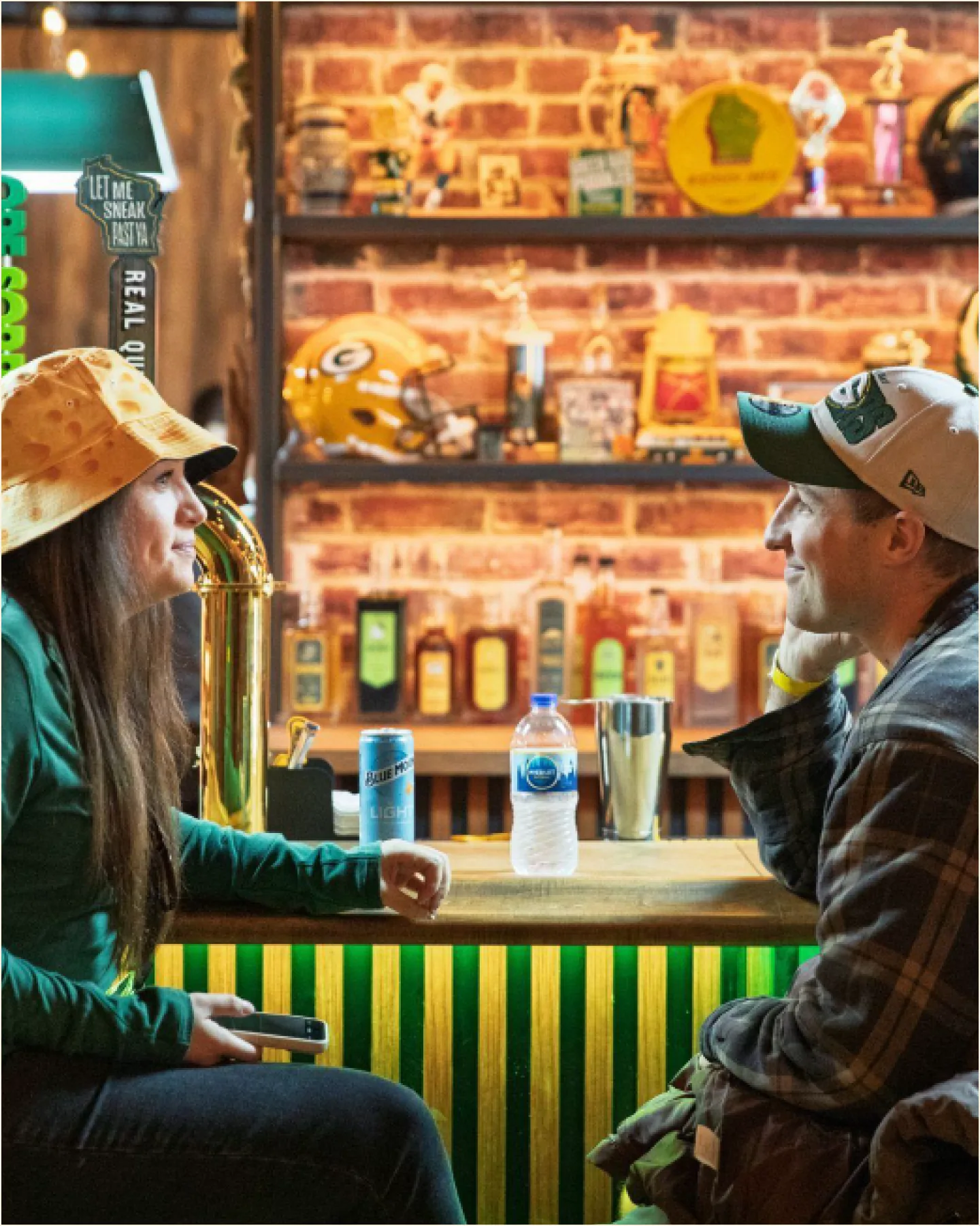 Two guests talking across a bar at an influencer event